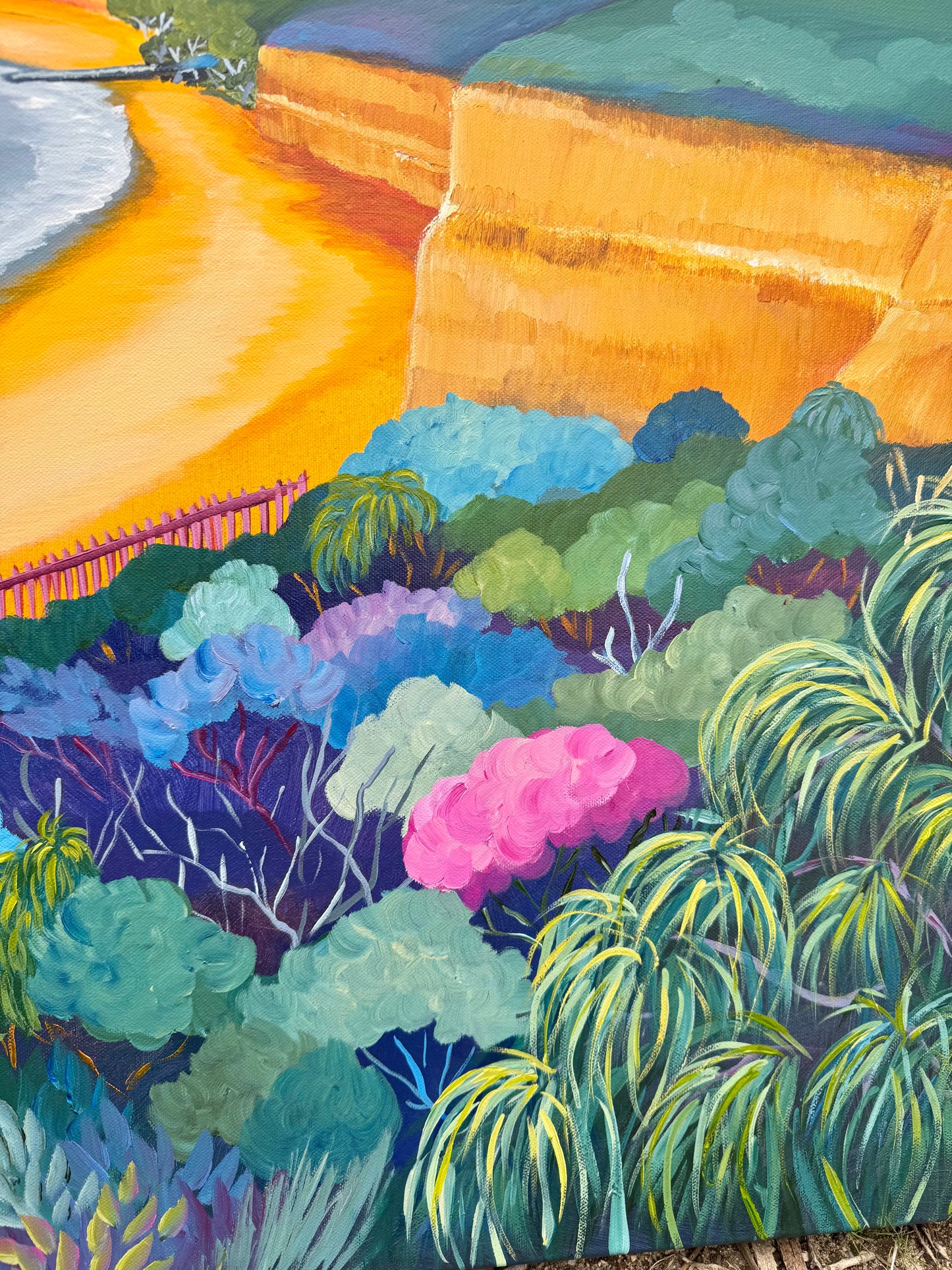 Close up of Anglesea - Point Roadknight at Sunrise painting artwork. Colourful trees and bushes with bright orange cliffs and sand