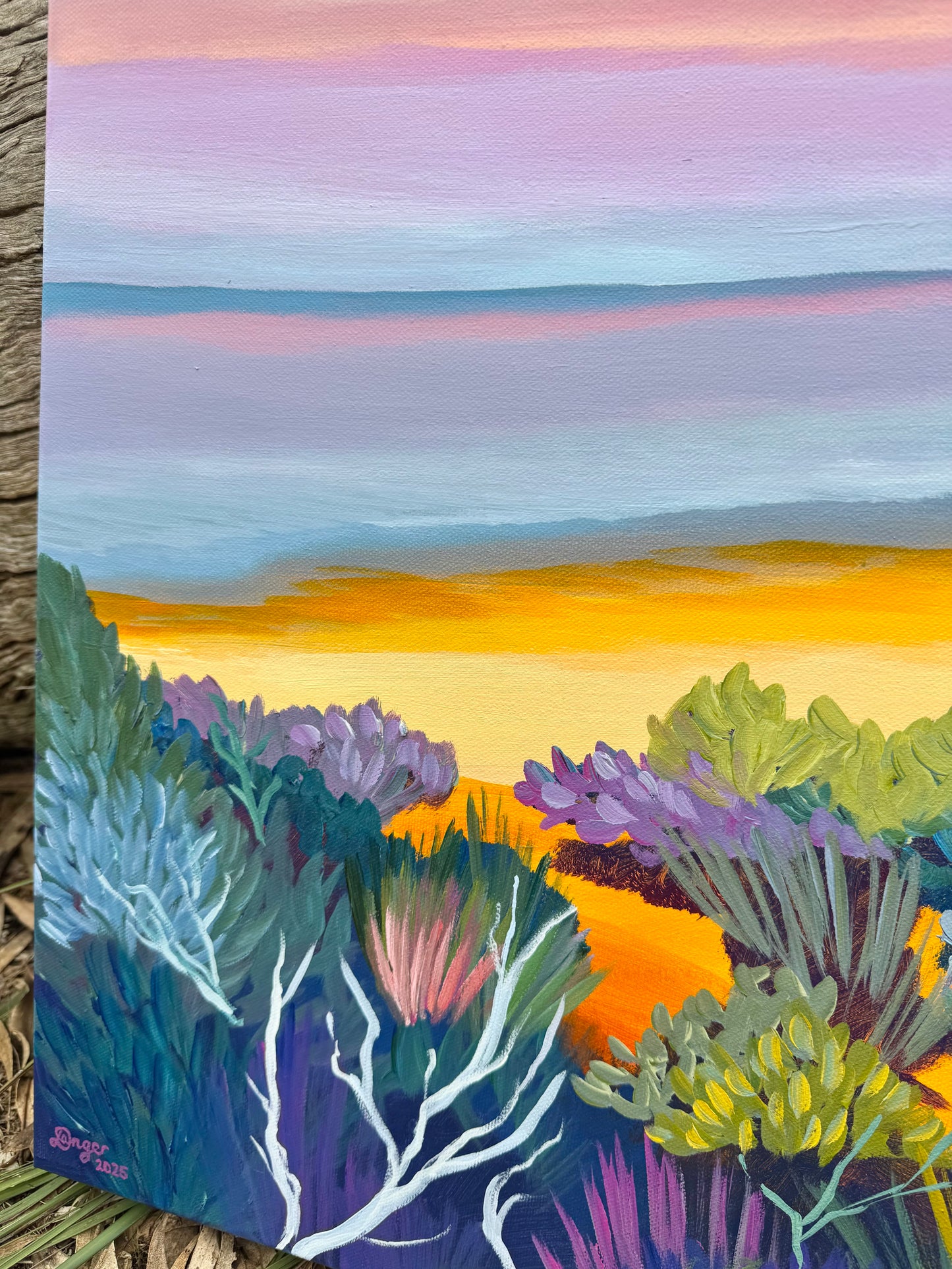 Close up of Anglesea - Point Roadknight at Sunrise painting artwork. Colourful trees and bushes with bright yellow sand. Blue, pinks and purples reflecting in the ocean