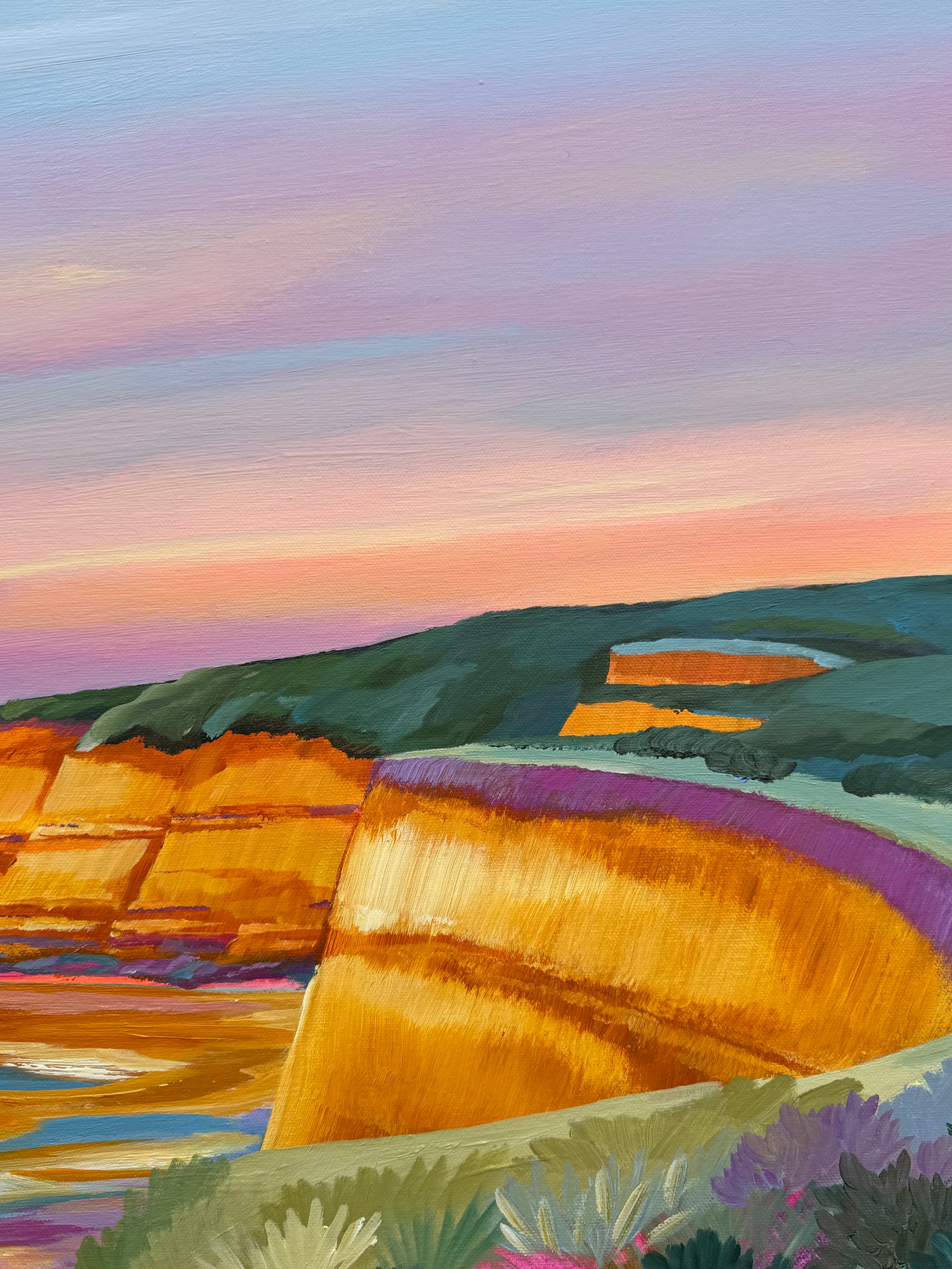 A close up of the colourful artwork Jan Juc at Sunrise by Lauren Danger.  The image has vibrant colours of the cliff in Jan Juc in acrylic.