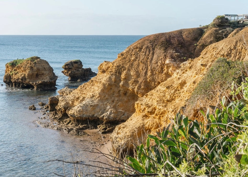 photo of the reference image used for Rocky point in Yellow located in Torquay, Great Ocean Road, Australia.  A balance of rocky cliff face and ocean.